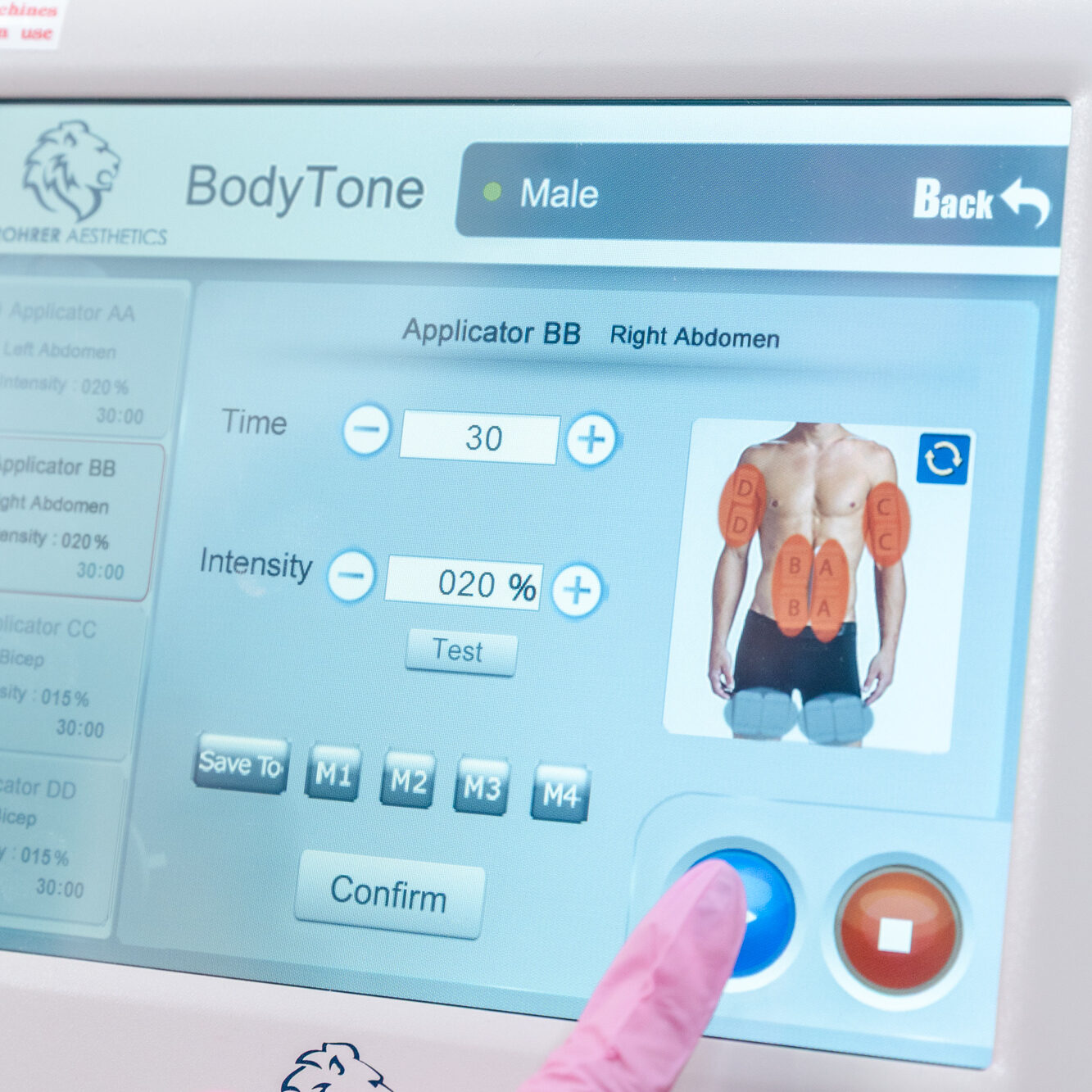 Provider adjusts BodyTone settings before beginning loose skin treatment in Farmington, NM