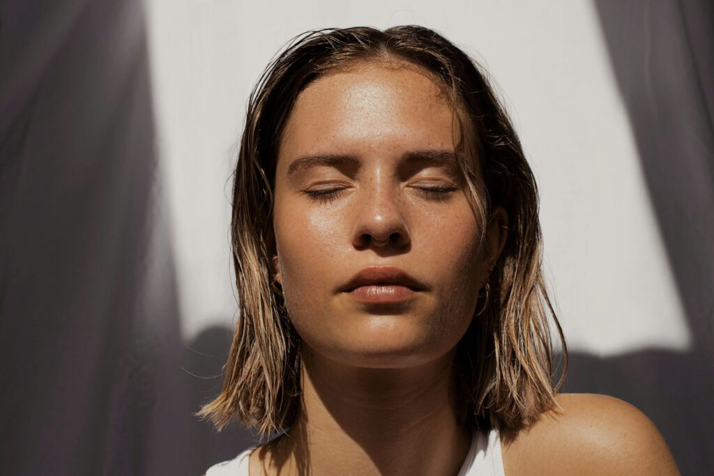 woman with her eyes closed in the sun